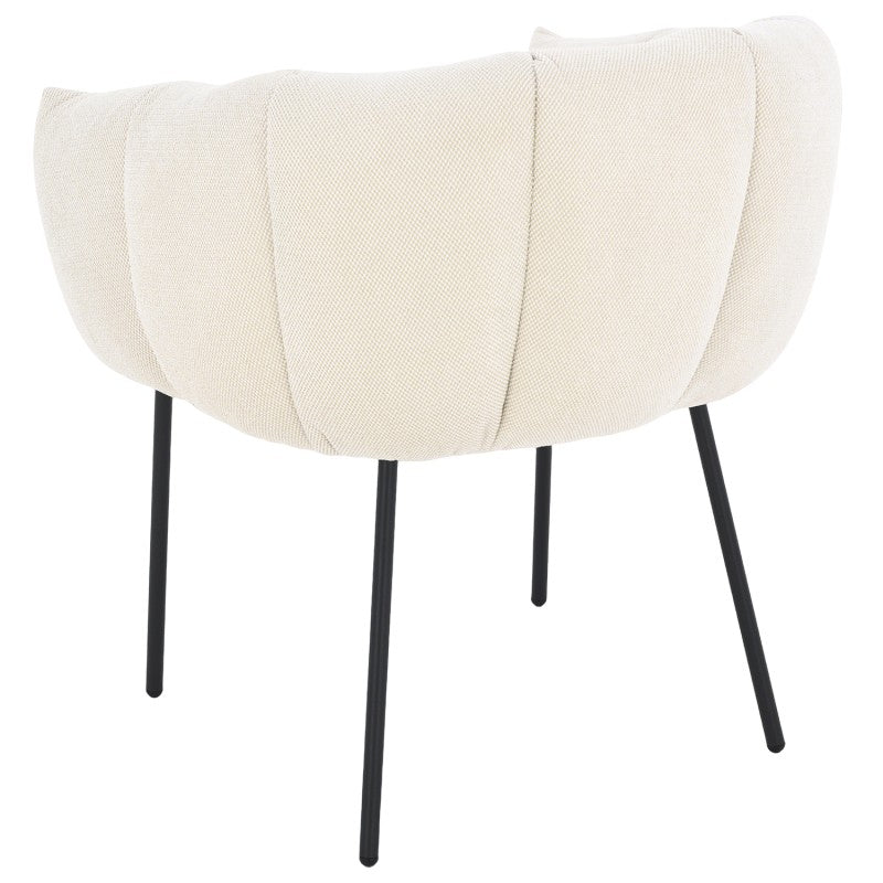 Der elegante Polstersessel vereint natürlichen Charme mit modernem Design und eignet sich perfekt für stilvolle Hotelzimmer